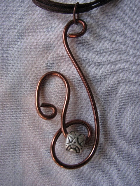 Brown wire pendant.