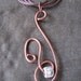 Brown wire pendant.