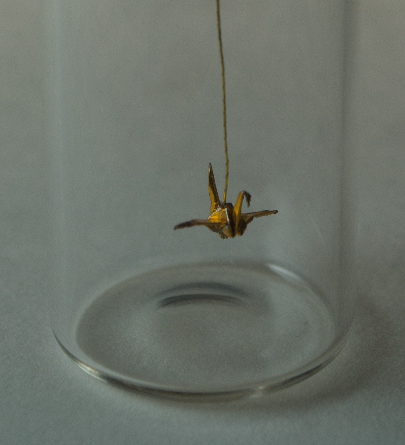tiny origami golden crane