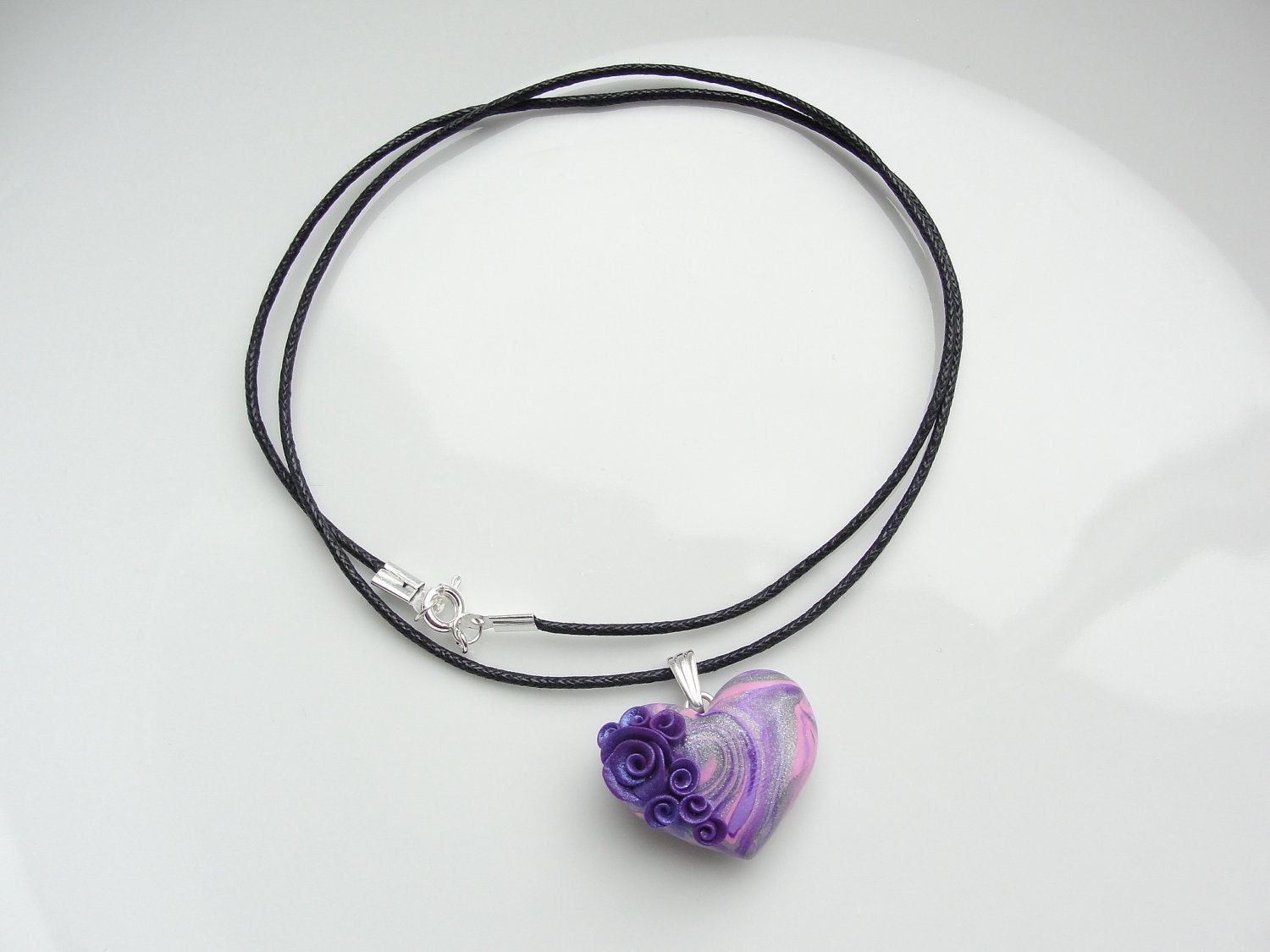 Heart pendant in pink, purple and silver with purple roses on black cotton cord necklace