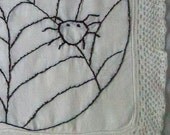 Vintage linen with halloween stitchery spider web