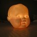 Porcelain Baby-doll head tea-light or votive cover
