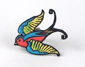 Medium Bright Red, Blue, Yellow, and Green Bird Ring