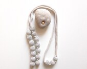 knitted necklace MIU grey, with marbles caught in a knitting