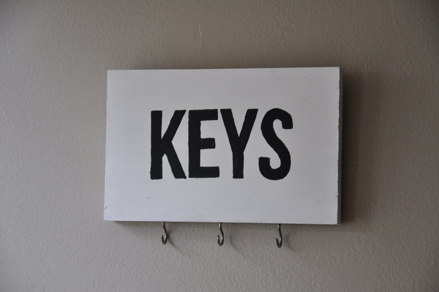 black and white hand made key rack
