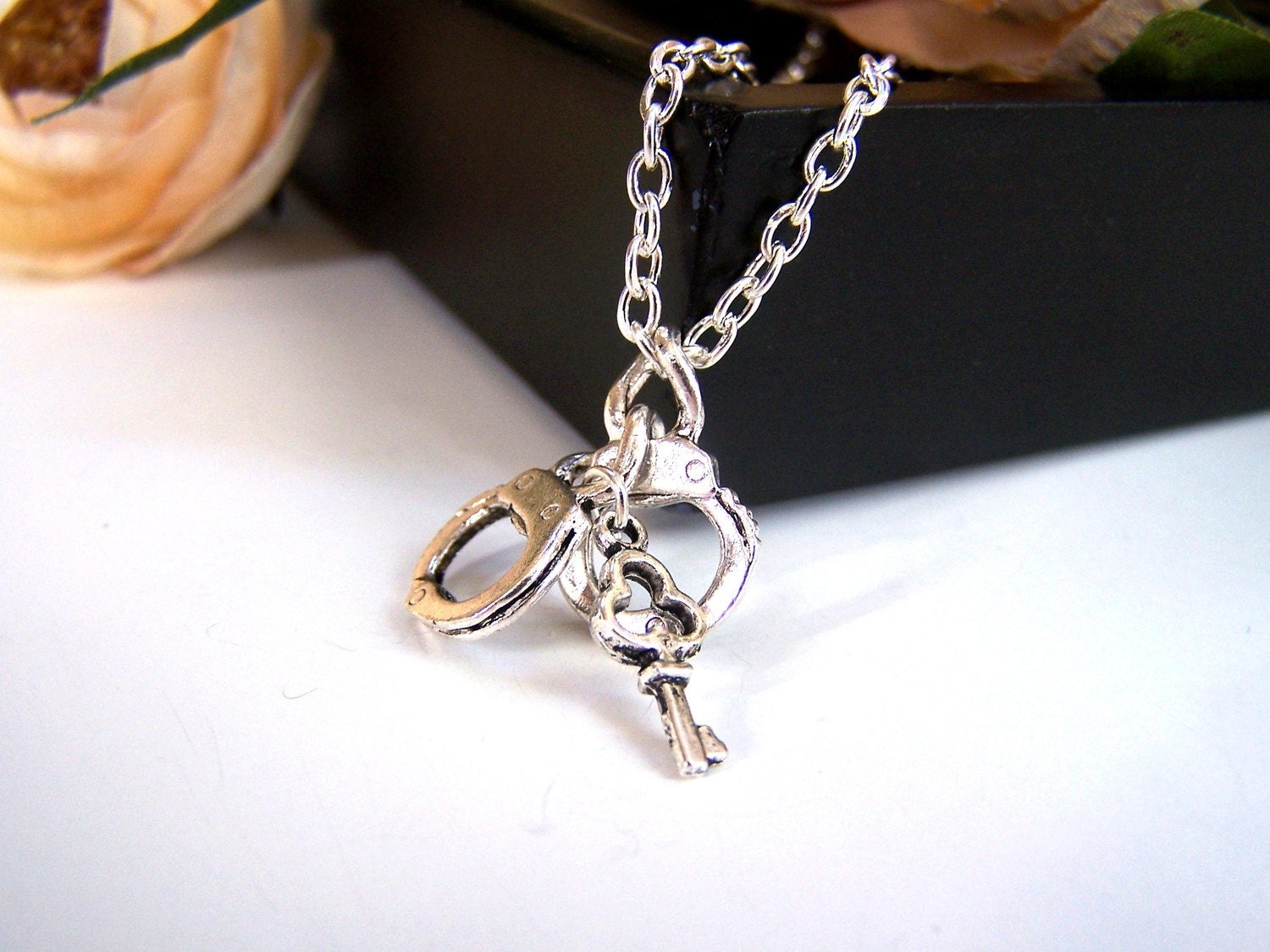 the handcuff necklace.