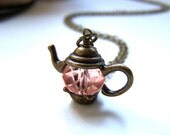 the crystal teapot necklace in bronze.