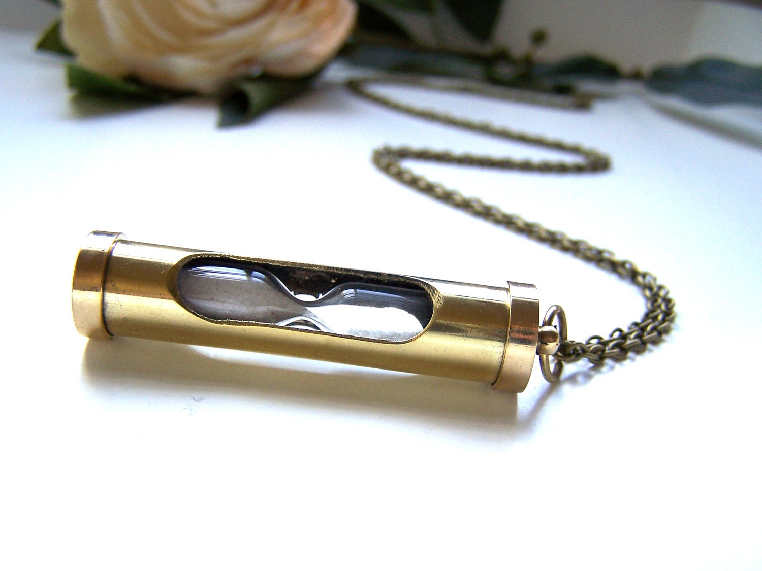 the hourglass necklace.