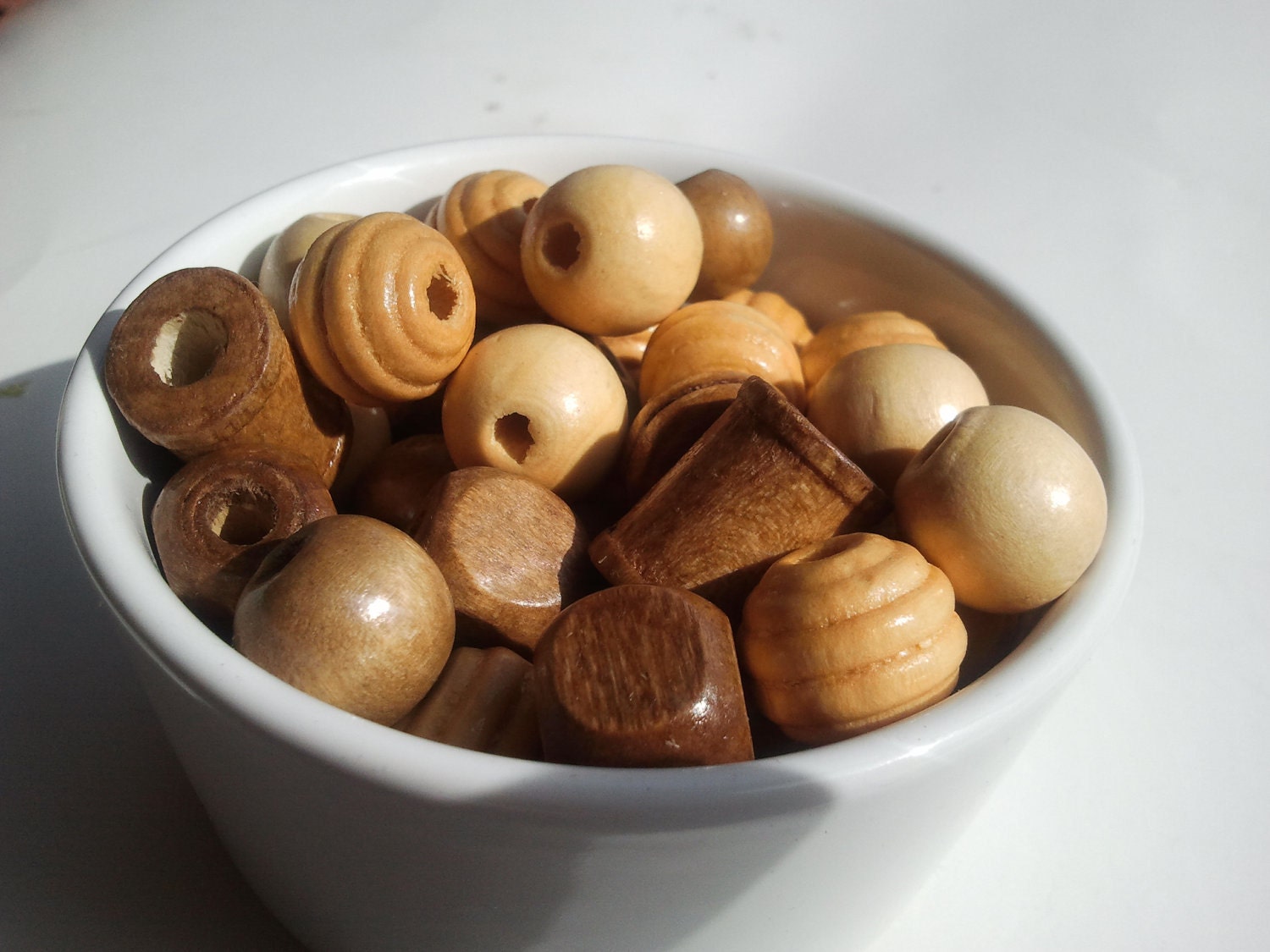 45 Mixed bag of maple, blonde and mahogany wood beads