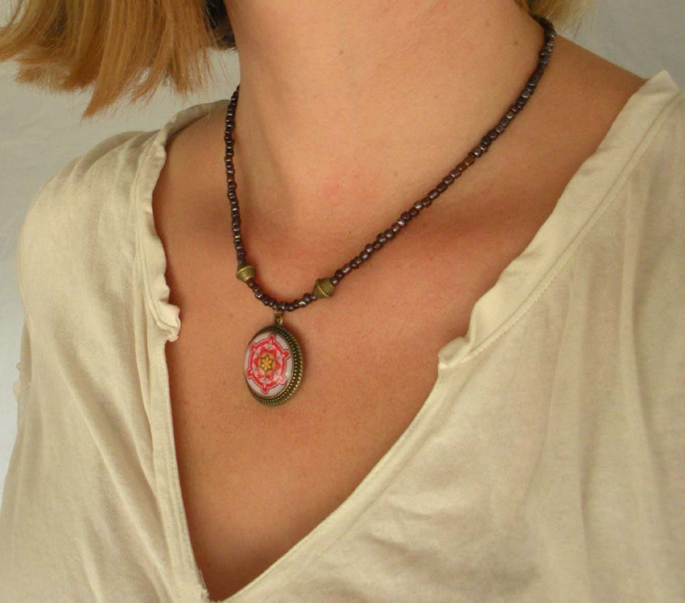 Spanish Tile Design Medallion in Red, Yellow & Pink on a Dark Plum Colored Beaded Necklace