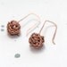 Earrings of copper wire.