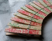 Decorative Christmas clothespins, set of 12 - red and green snowflake stamped pattern.  Hand stamped clothes pins.