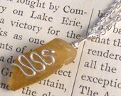 Yellow sea glass necklace with silver plate serpentine twist accent, silver plate