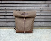 Waxed canvas rucksack/backpack with roll up top and waxed leather shoulderstrap,handle and leather bottem COLLECTION UNISEX