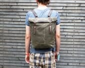 Waxed canvas rucksack/backpack with roll up top and waxed leather shoulderstrap
