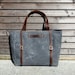 Waxed canvas bag/ carry all with leather handles and double buckle closure with straps COLLECTION UNISEX