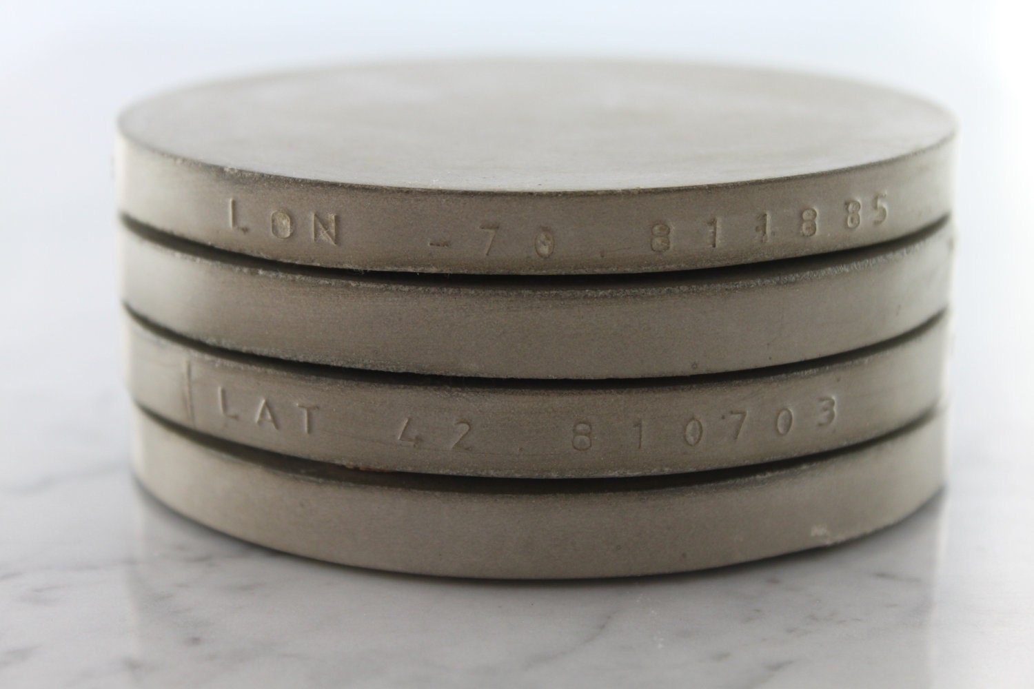 Custom. Concrete. Latitude. Longitude. Coasters