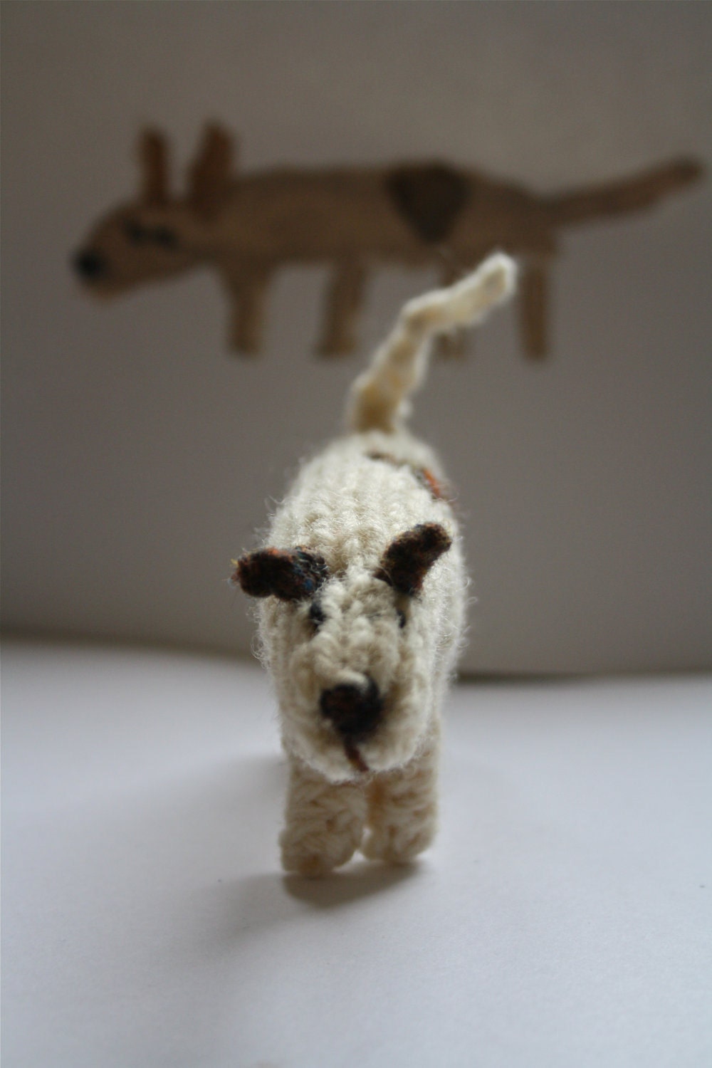 Little hand knitted patch dog