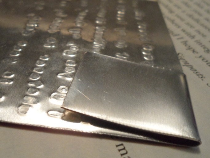 e.e. cummings hand stamped metal book marker