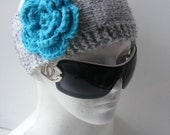 Gray hand knitted headband ear warmer with crochet flower in turquoise blue color