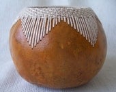 Small gourd bowl with stitched and woven V pattern at rim.  1608