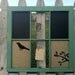 burlap covered corkboard, chalkboard, and chickenwire combo in vintage barnwood window