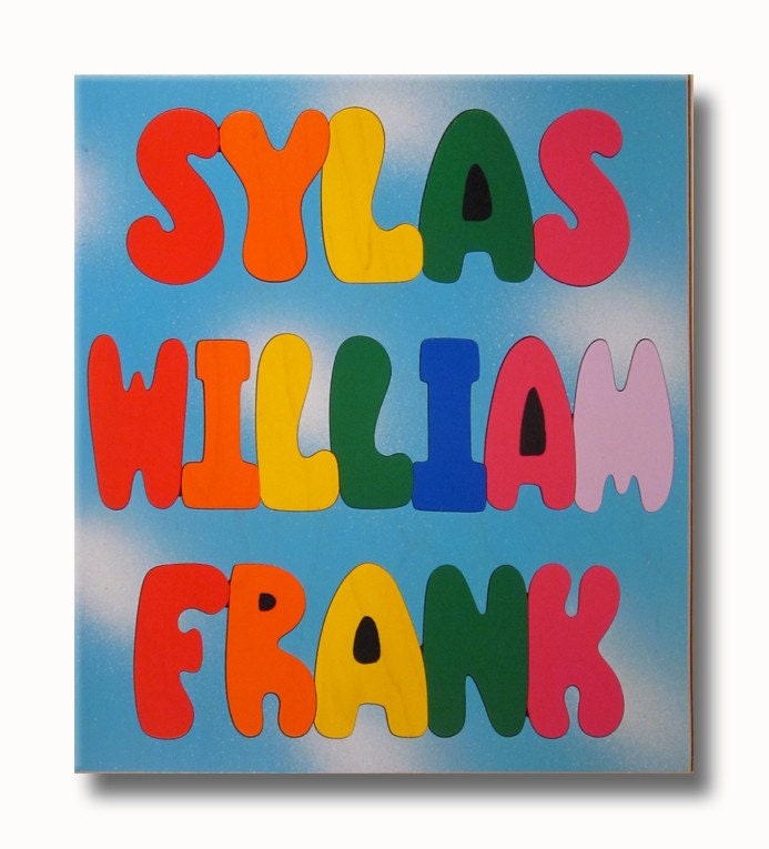 Wooden Three Name Puzzle ALL CAPITALS on Blue Day Sky Background