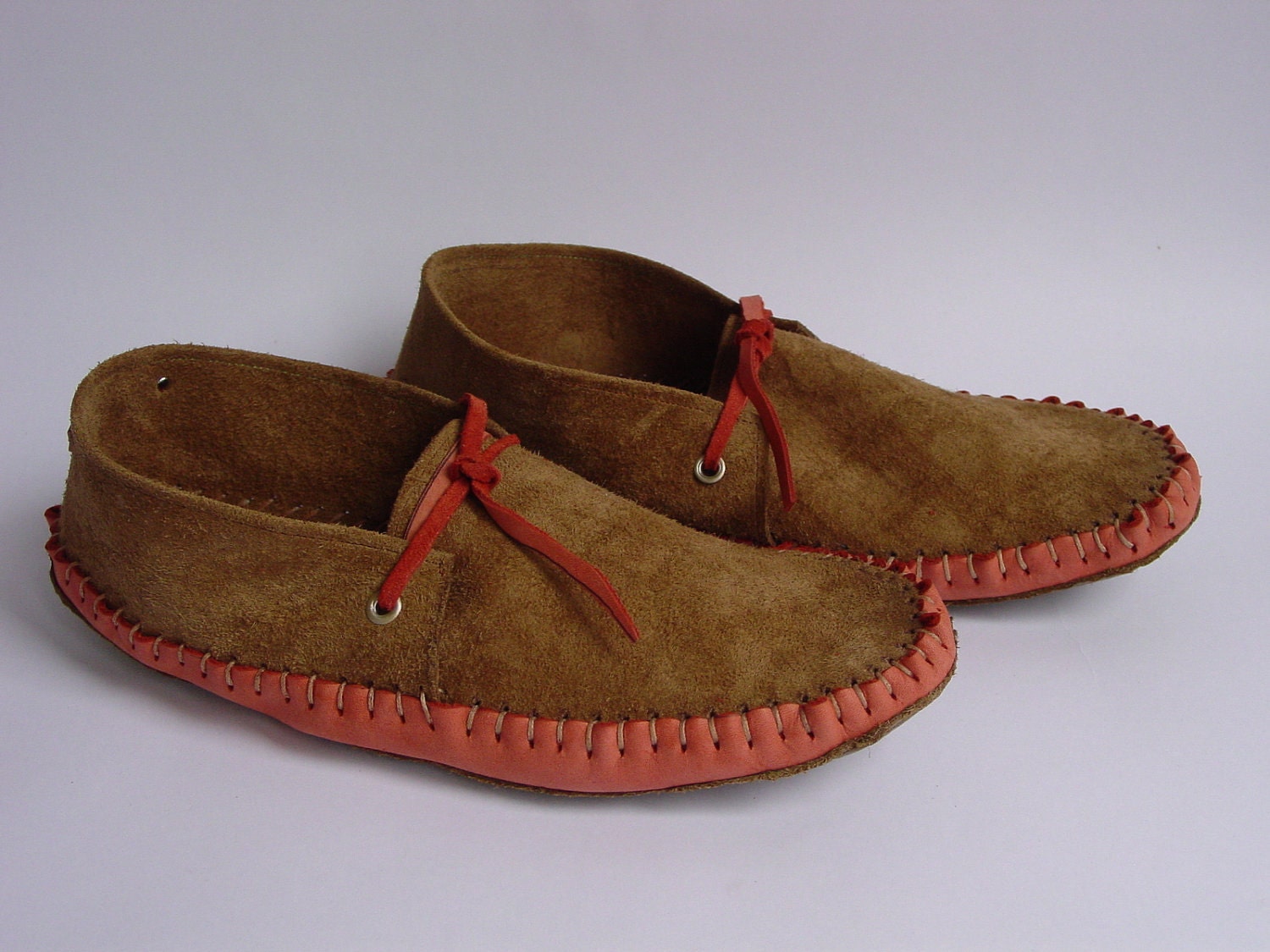 Warm brown suede and coral colored moccasins