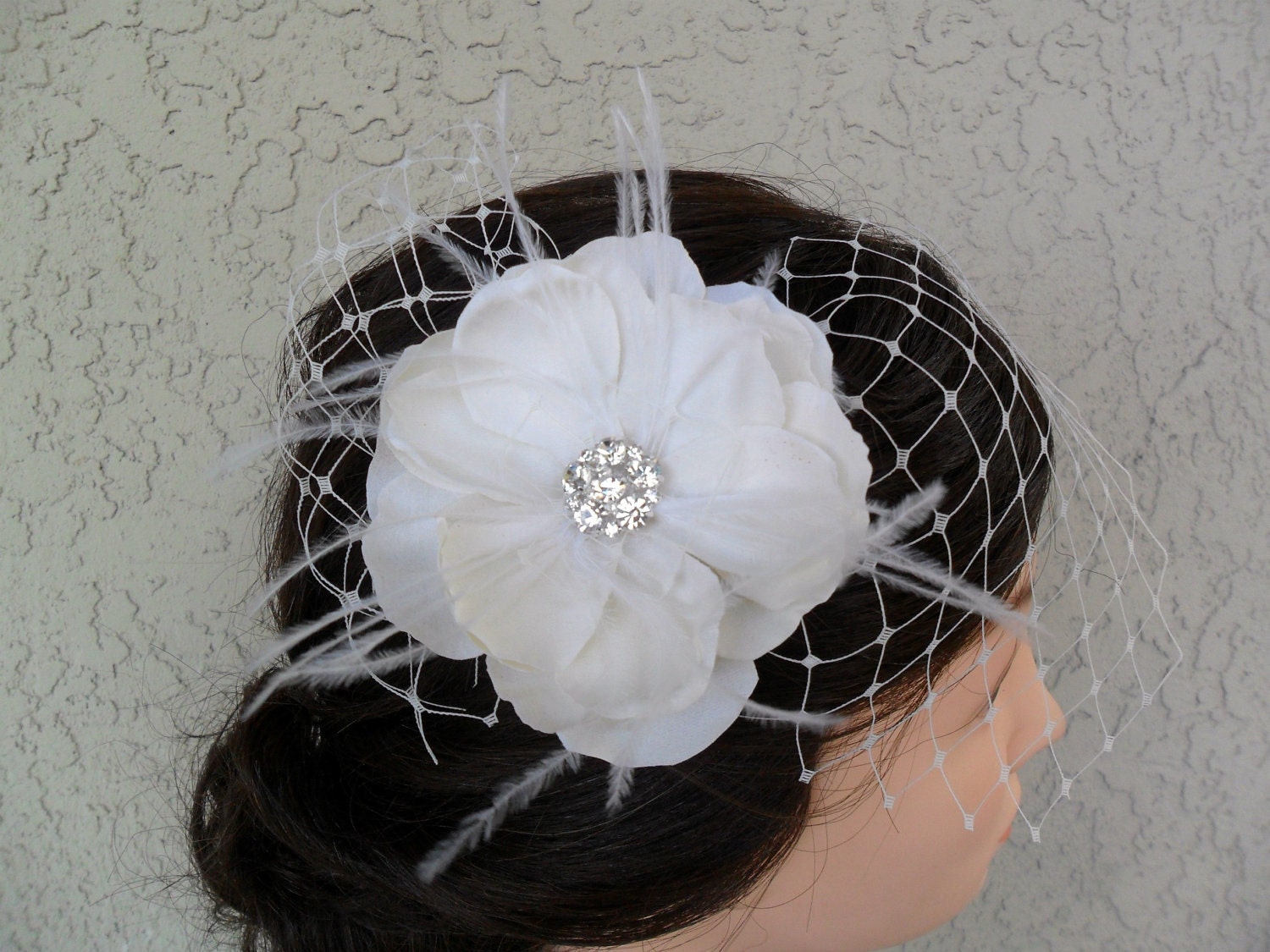 feathered ivory hair fascinator with french veil