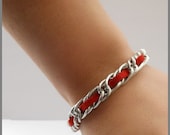 red OASIS single strand bracelet
