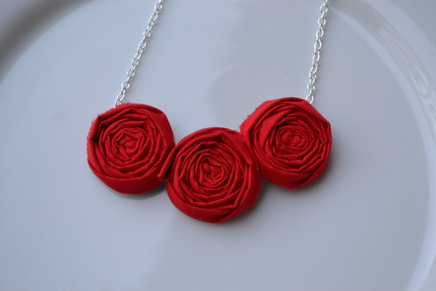 Red triple rosette necklace
