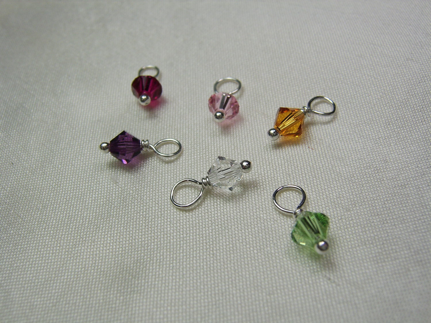Add a small Swarovski birthstone crystal dangle
