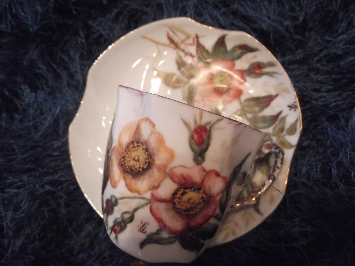 Handpainted Demi cup and saucer with the initials LL- unmarked  -DR