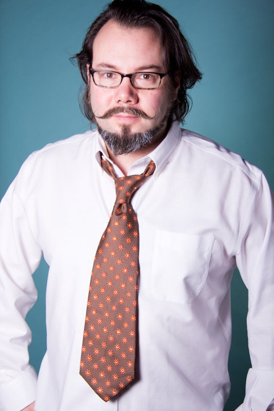The Wagon Wheel Tie: Olive Drab Necktie with Orange & White Accents and Orange Swarovski Rhinestones