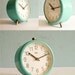Vintage turquoise mechanical alarm clock working