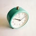 Vintage turquoise mechanical alarm clock working