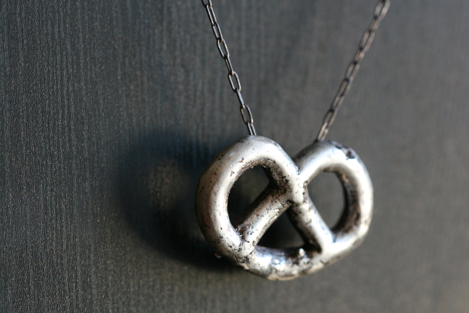 silver pretzel necklace: sterling silver pendent on sterling silver chain