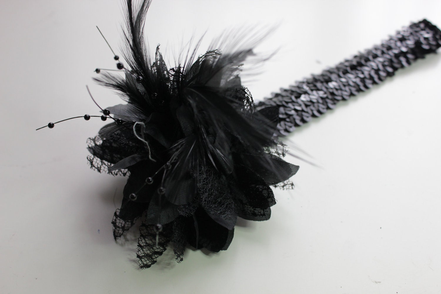1920s black feather flapper headband races