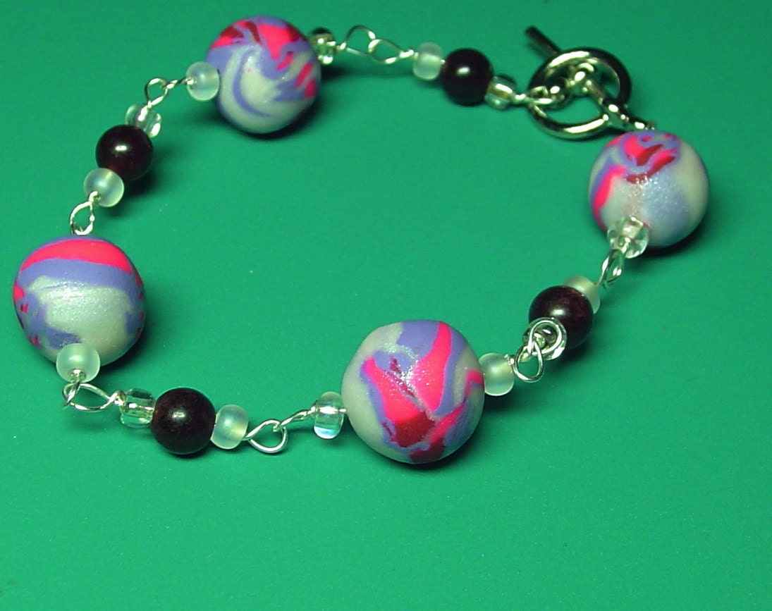 Beaded bracelet. silver wire wrapped bracelet. polymer clay bracelet pink and purple red and white