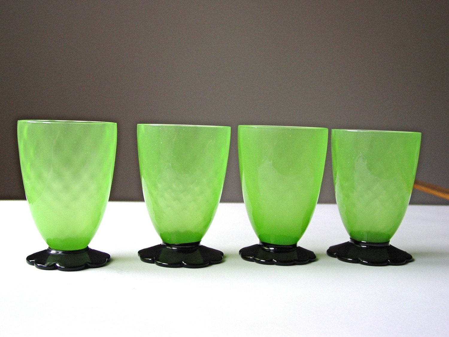 SALE...Grey Gardens Juice Glasses Absinthe Green Depression Glass Black Flower Feet Vaseline