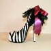 Zebra peeptoe pump with satin bow and feathers