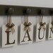 Laundry Room Wall Decor includes Wooden 9 Peg Hanger and LAUNDRY, Washboard and Bucket in Chocolate Brown