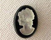 Vintage mid century mother of pearl on black glass cameo cabochon