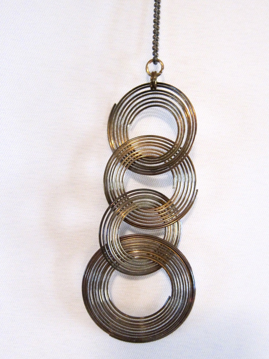 Vintage retro groovy 1970s tribal brass ring pendant