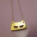 Mask necklace brass