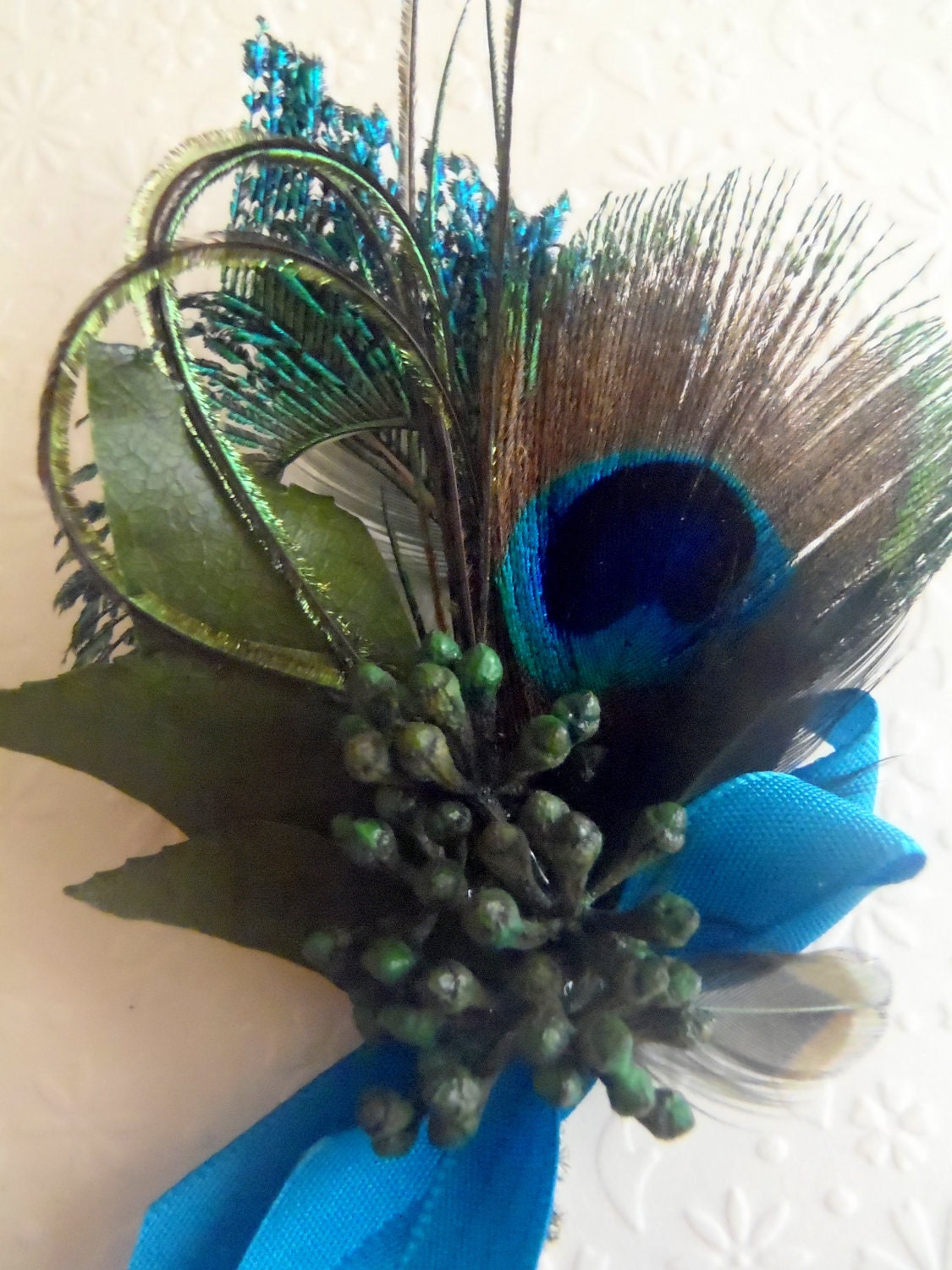 Peacock boutonniere, lovely and elegant classic favorite