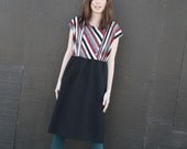 Black and striped two tone pencil dress.