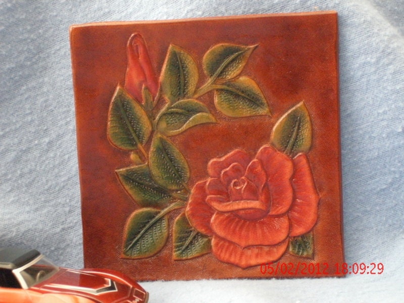 Hand tooled red rose drink mat