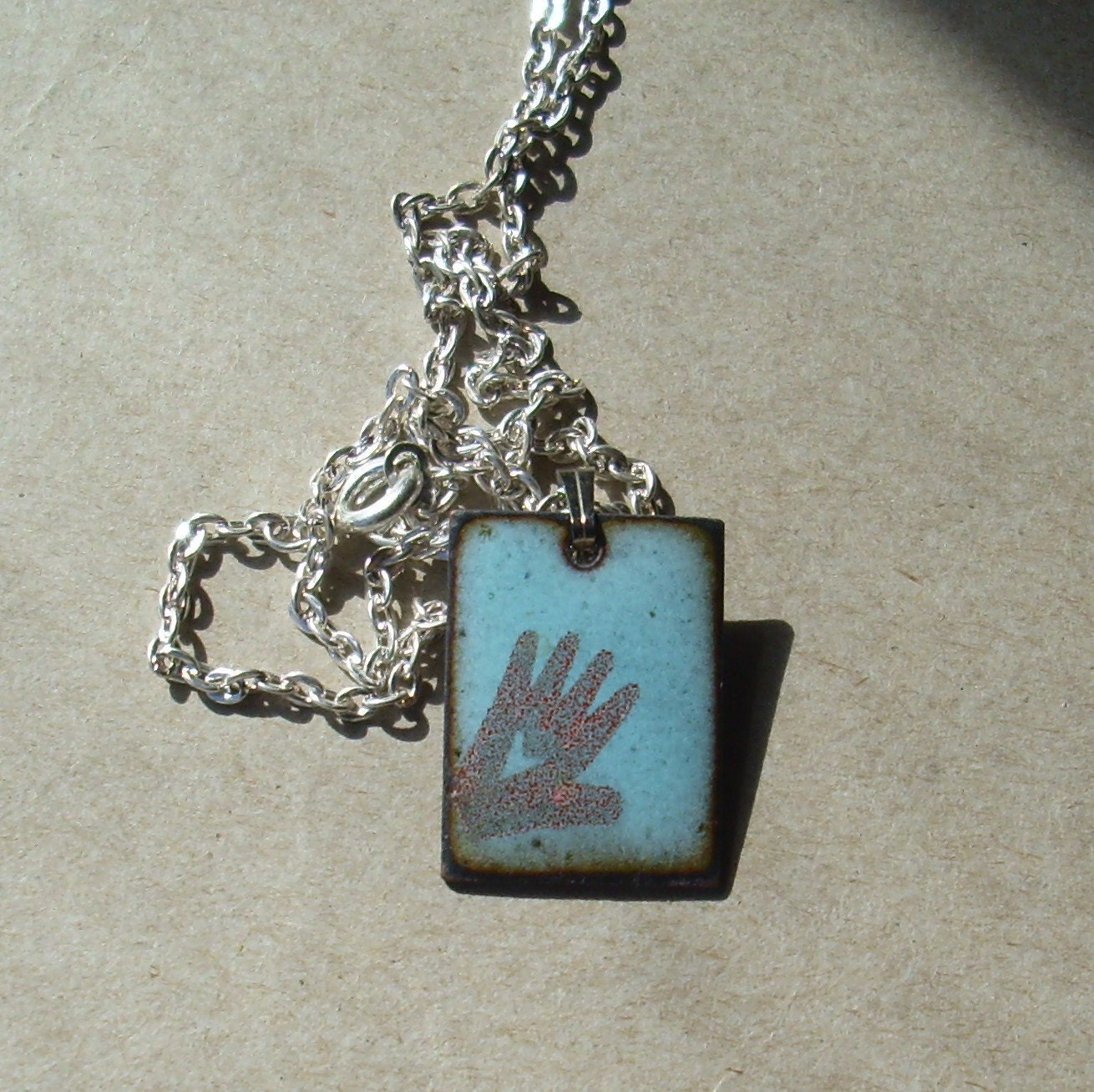 Heart in Hand- enameled necklace     T114