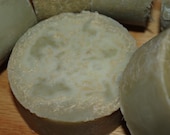 Loofa is Lovely embedded in this Cinnamon and Rosemary essential oil scented round exfoliating soap bar